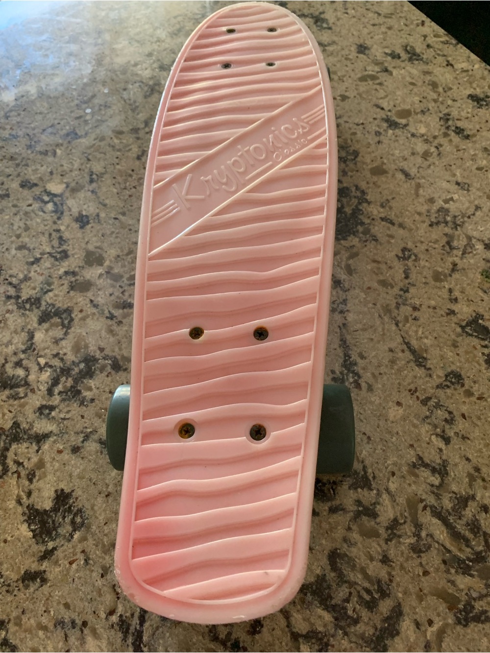Red faded to pink Kryptonics Classic Torpedo 22-inch plastic cruiser skateboard.